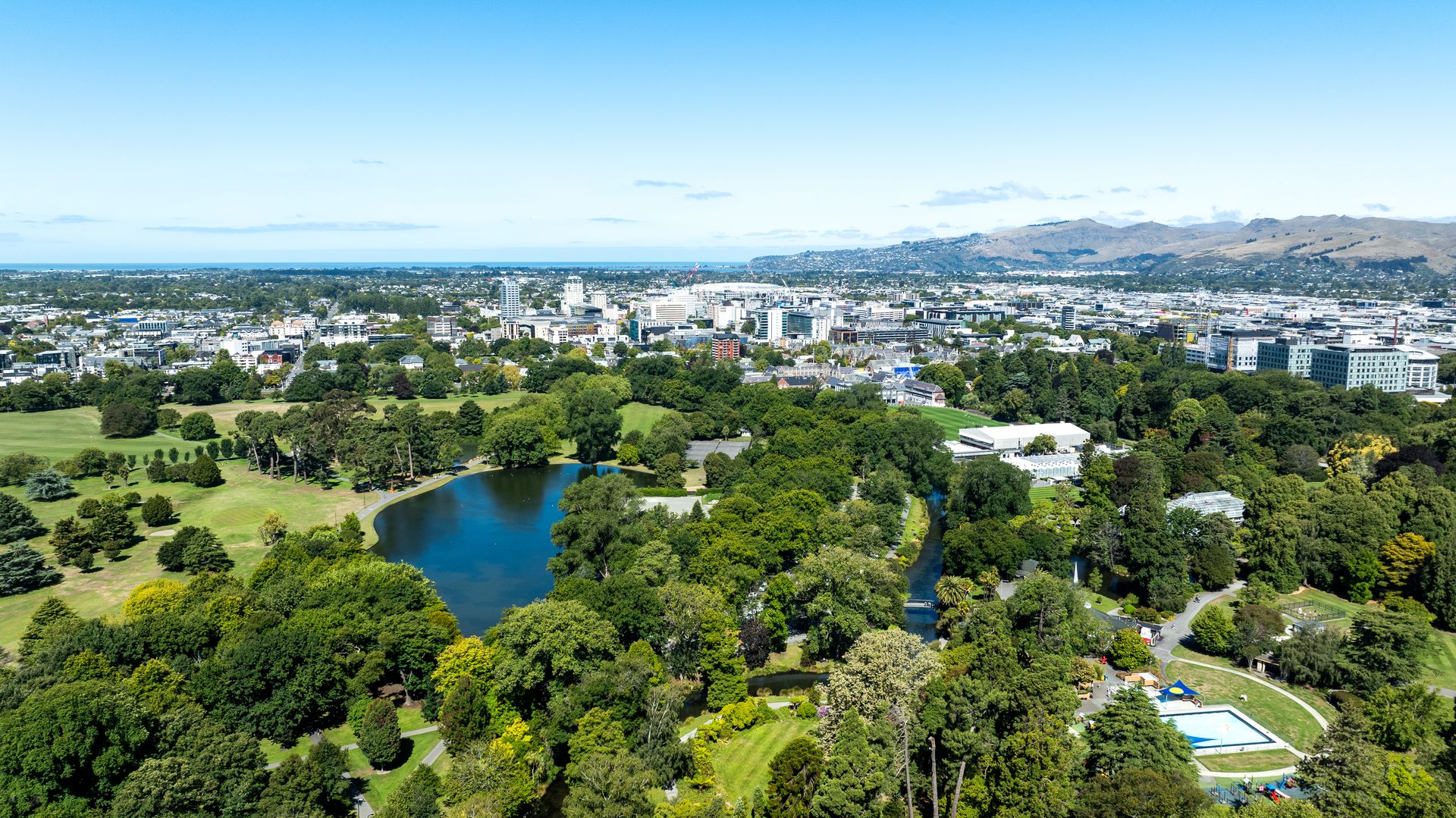 Aerial view of Hagley Park, central Christchurch and the Port Hills beyond