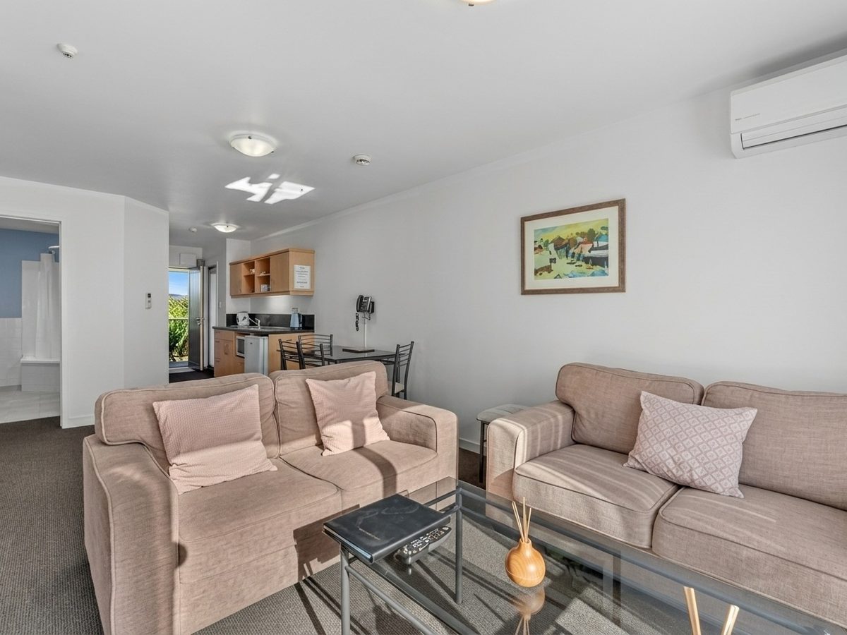 Two-Bedroom Apartment interior — full separate lounge, dining area and kitchenette